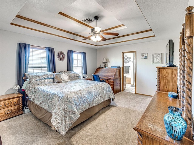 910860 S 3350th Rd, Wellston, OK 74881 - carpeted bedroom featuring a textured ceiling, visible vents, ensuite bathroom, a raised ceiling, and ceiling fan