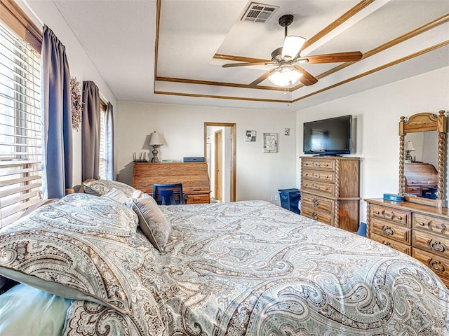 910860 S 3350th Rd, Wellston, OK 74881 - bedroom with a ceiling fan, a tray ceiling, and visible vents