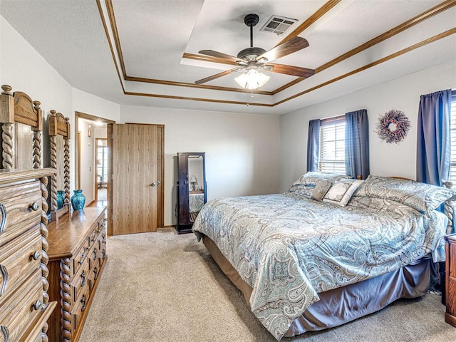 910860 S 3350th Rd, Wellston, OK 74881 - bedroom with a tray ceiling, crown molding, visible vents, and light carpet