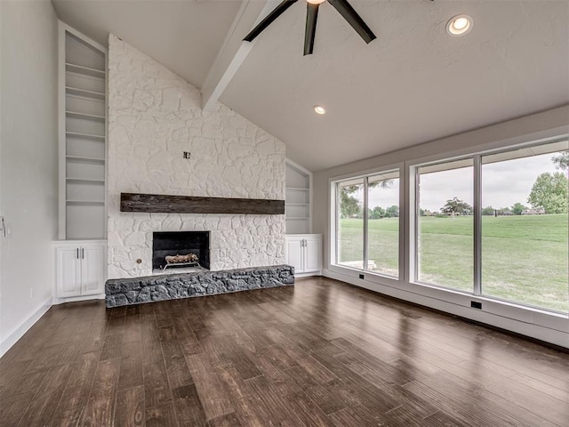 unfurnished living room featuring lofted ceiling with beams, a ceiling fan, built in shelves, and wood finished floors