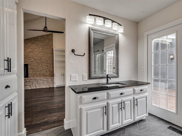 bathroom with visible vents, ceiling fan, and vanity