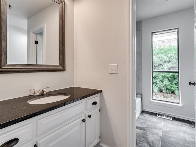 full bath featuring visible vents and vanity