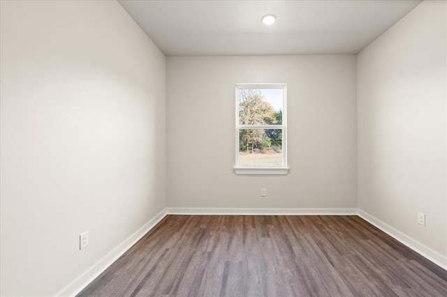 812 Stella Trl, Guthrie, OK 73044 - unfurnished room with baseboards and dark wood-style floors