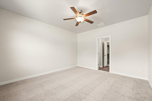 812 Stella Trl, Guthrie, OK 73044 - spare room with carpet floors, a ceiling fan, and baseboards