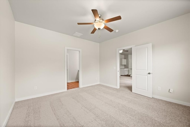 812 Stella Trl, Guthrie, OK 73044 - unfurnished bedroom with baseboards, ceiling fan, and carpet
