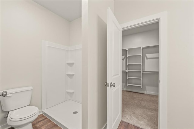 812 Stella Trl, Guthrie, OK 73044 - full bathroom with a walk in shower, toilet, baseboards, and wood finished floors