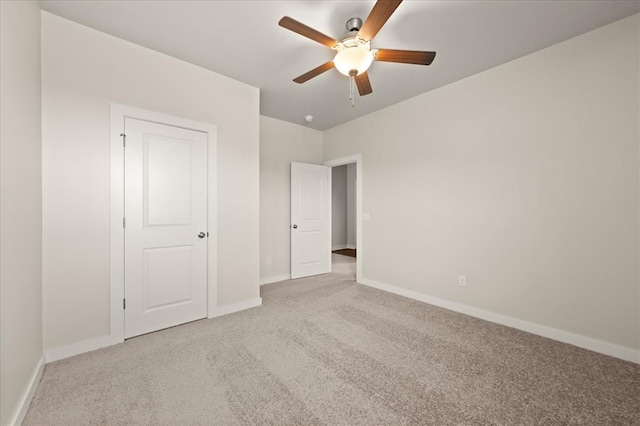 812 Stella Trl, Guthrie, OK 73044 - unfurnished bedroom with baseboards, carpet flooring, and a ceiling fan