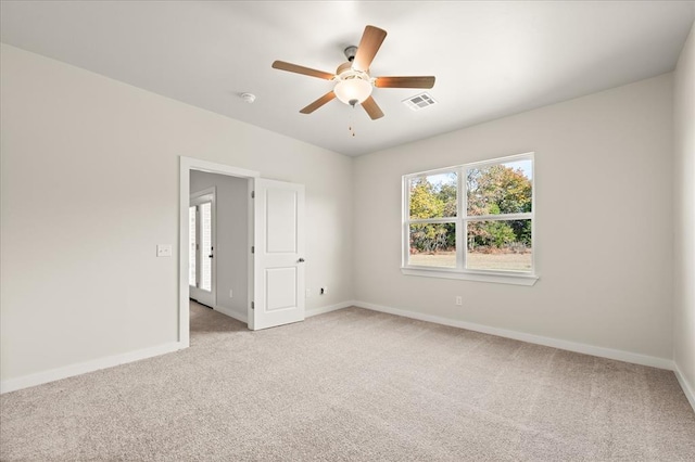 812 Stella Trl, Guthrie, OK 73044 - interior space featuring baseboards, light carpet, a ceiling fan, and visible vents