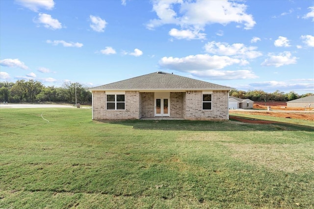 812 Stella Trl, Guthrie, OK 73044 - rear view of house featuring a lawn, french doors, and brick siding