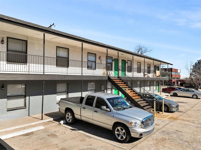 3509 N Nesbitt Ave, Oklahoma City, OK 73112 - view of building exterior with uncovered parking and stairway