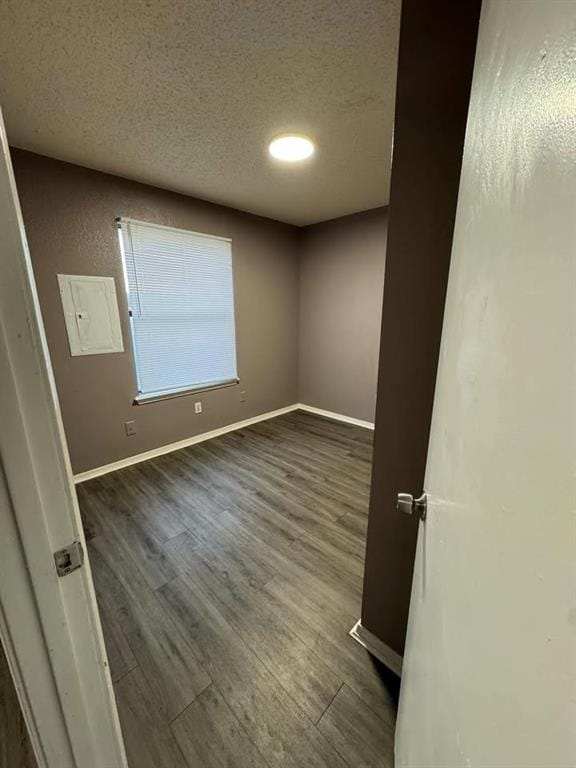 3509 N Nesbitt Ave, Oklahoma City, OK 73112 - spare room featuring wood finished floors, a textured ceiling, and baseboards