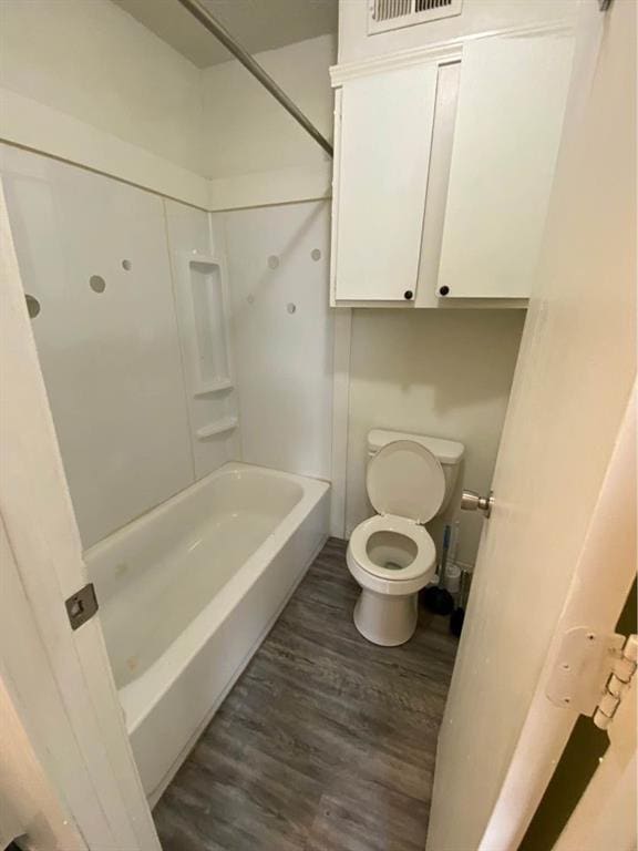 3509 N Nesbitt Ave, Oklahoma City, OK 73112 - bathroom with wood finished floors, toilet, and shower / washtub combination