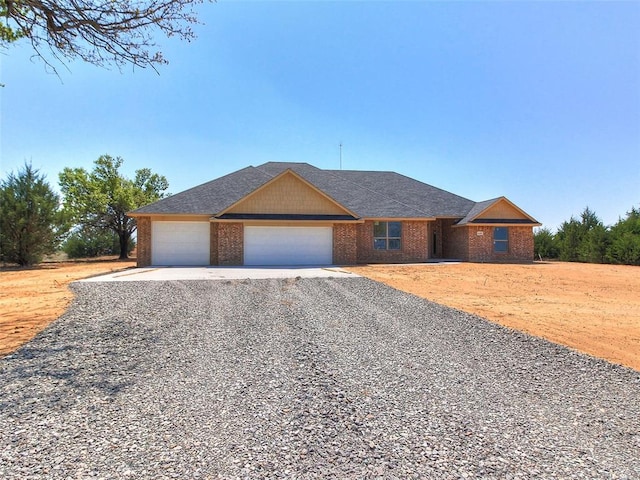 343787 E 870th Rd, Chandler, OK 74834 - single story home featuring brick siding, an attached garage, and driveway