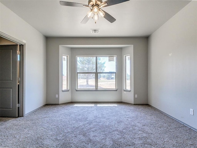 343787 E 870th Rd, Chandler, OK 74834 - carpeted spare room with ceiling fan, visible vents, and baseboards