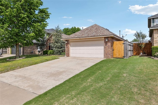 view of front facade with brick siding, a front lawn, and fence