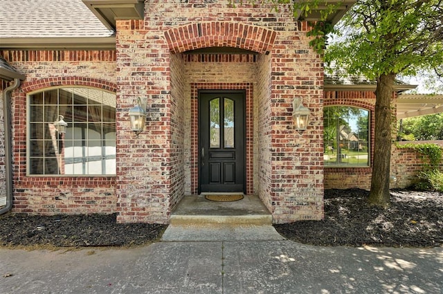 entrance to property with brick siding