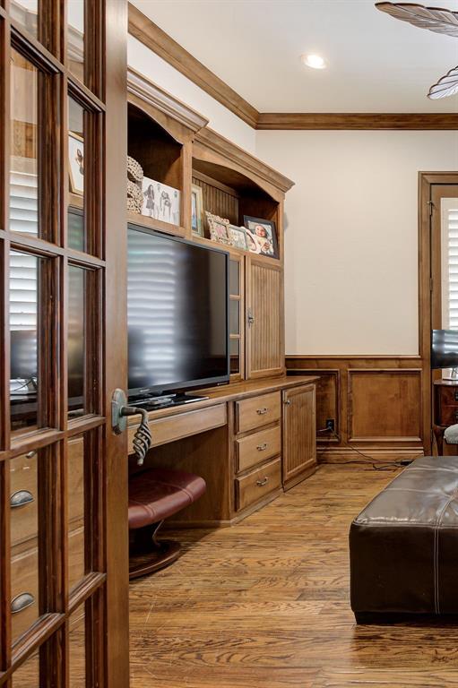 office with crown molding, recessed lighting, wainscoting, and light wood-style floors