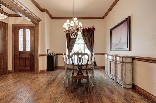dining room with crown molding, baseboards, a chandelier, and dark wood-type flooring