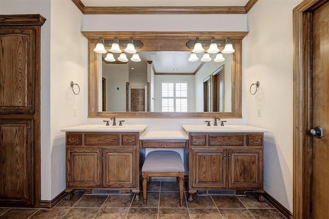 full bathroom featuring a sink, baseboards, and crown molding
