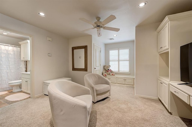 sitting room featuring light colored carpet, recessed lighting, baseboards, and ceiling fan