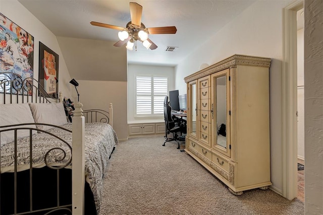 bedroom featuring ceiling fan, light colored carpet, baseboards, vaulted ceiling, and visible vents