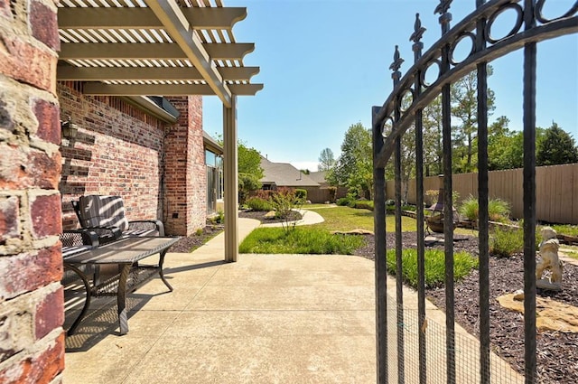 view of patio with a pergola and a fenced backyard
