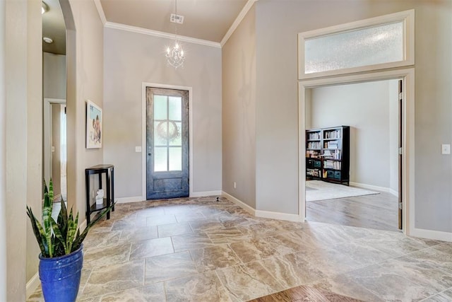 foyer with crown molding, baseboards, a high ceiling, stone finish floor, and arched walkways