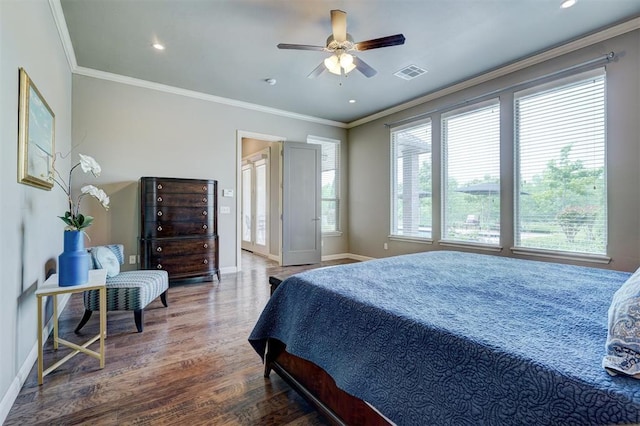bedroom with visible vents, crown molding, wood finished floors, baseboards, and recessed lighting