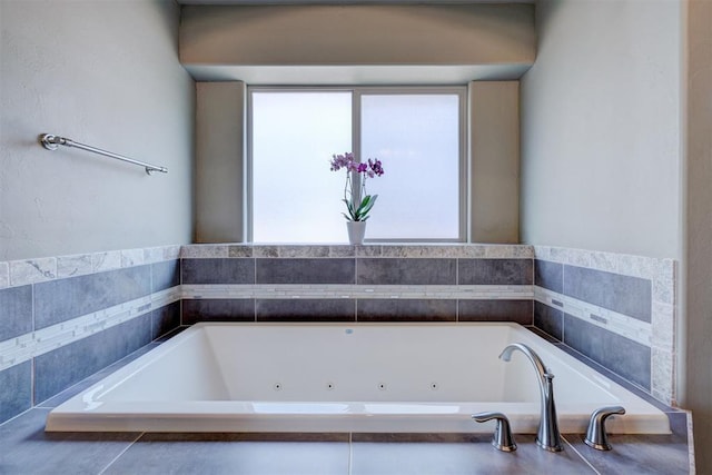 full bathroom with a jetted tub