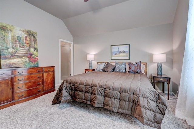 bedroom featuring carpet flooring and vaulted ceiling