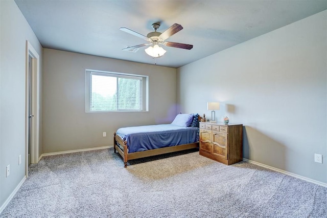 bedroom with carpet floors, a ceiling fan, and baseboards