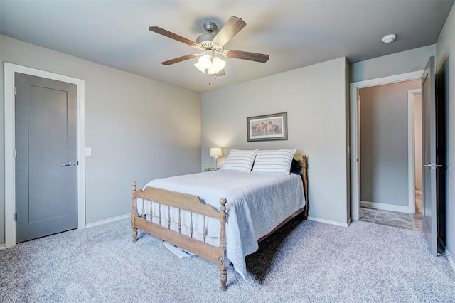 bedroom with carpet floors, baseboards, and a ceiling fan