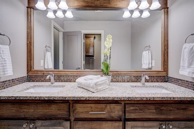 full bath featuring double vanity and a sink