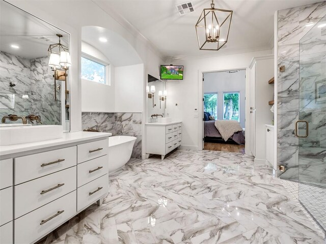 ensuite bathroom featuring visible vents, a marble finish shower, a notable chandelier, and a wealth of natural light