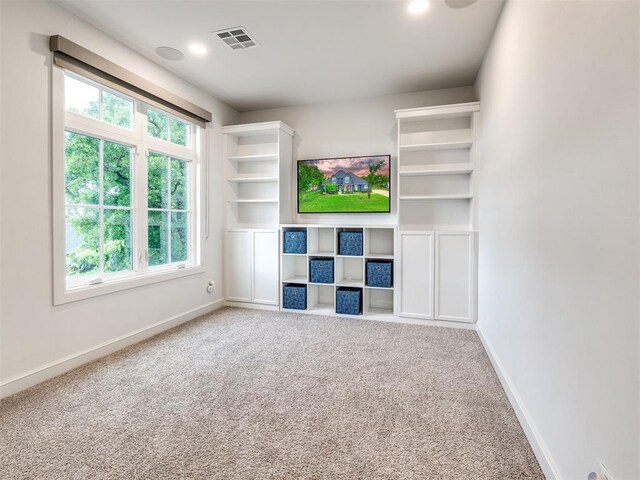 unfurnished living room with baseboards, carpet flooring, visible vents, and recessed lighting