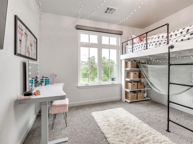 bedroom featuring baseboards, visible vents, and carpet