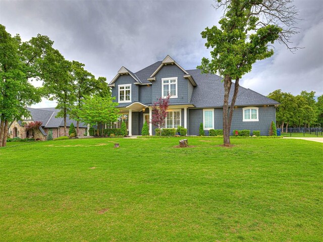 craftsman-style house with a front yard
