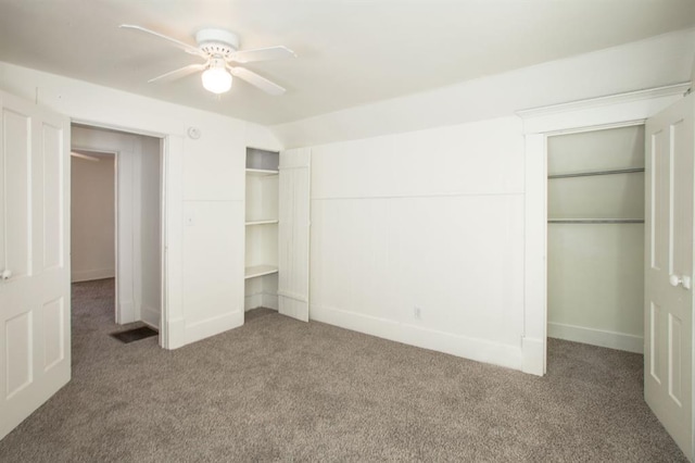 unfurnished bedroom featuring carpet floors, a ceiling fan, and baseboards