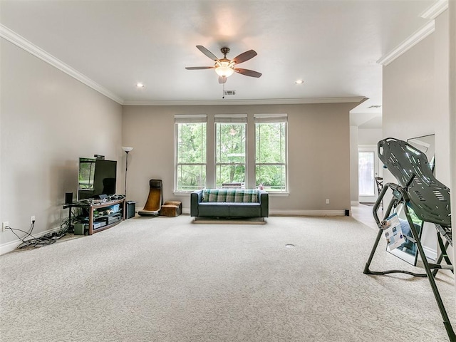 interior space with a healthy amount of sunlight, baseboards, ceiling fan, and carpet