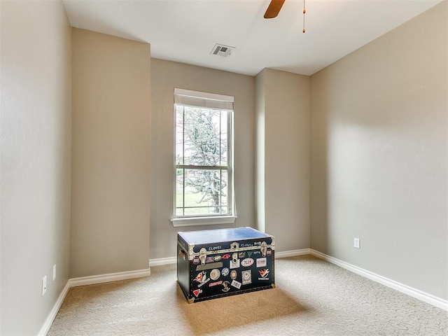 unfurnished room with visible vents, baseboards, ceiling fan, and carpet floors