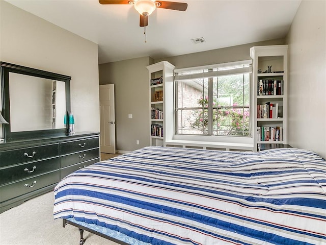 bedroom with ceiling fan, carpet flooring, and visible vents