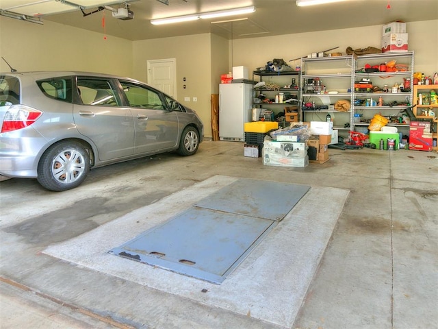 garage featuring a garage door opener