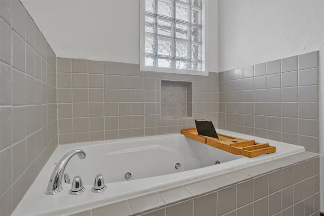 full bathroom featuring a whirlpool tub
