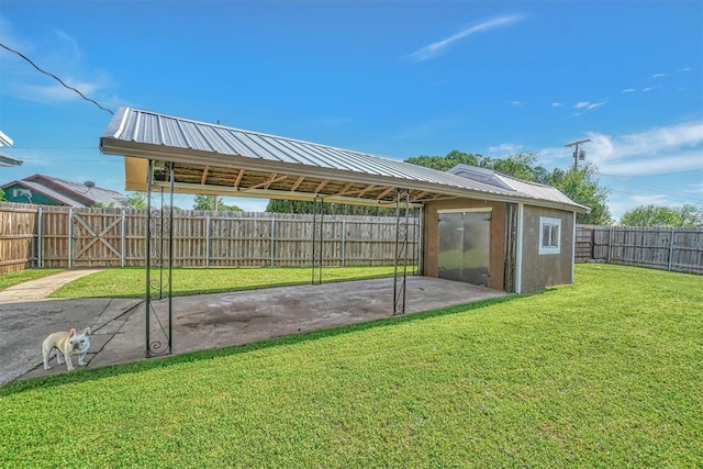 exterior space with an outbuilding and a fenced backyard