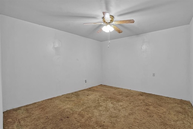 unfurnished room featuring carpet floors and a ceiling fan