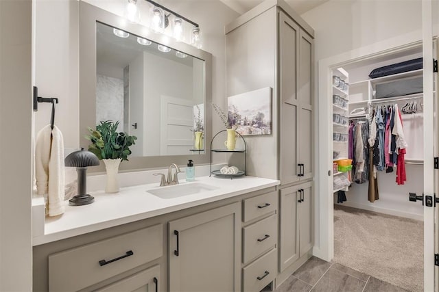 full bath with a spacious closet and vanity