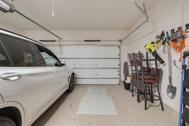 garage featuring a garage door opener
