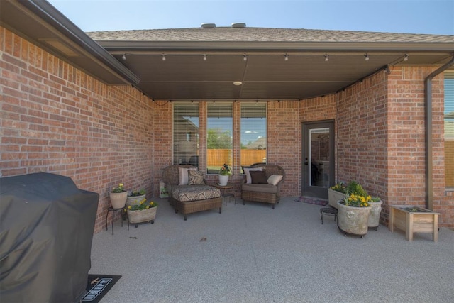 view of patio with an outdoor living space and grilling area