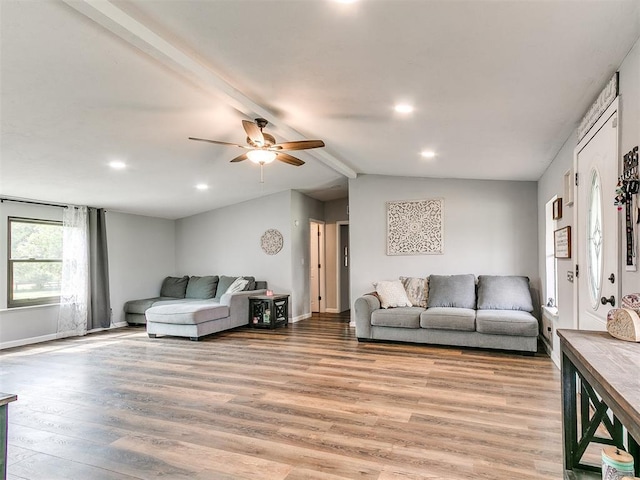 living room with a ceiling fan, light wood-type flooring, baseboards, vaulted ceiling with beams, and recessed lighting