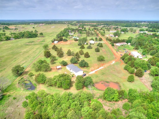 birds eye view of property with a rural view